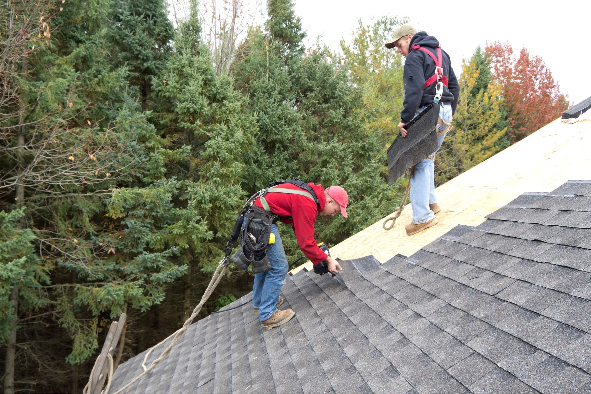 2 roofers working on a roof in St Catharines.